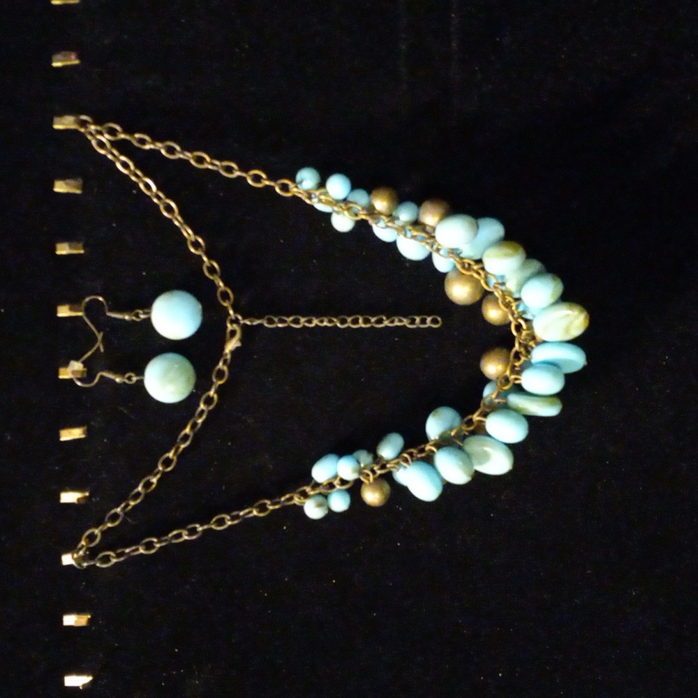 Paparazzi smokey blue acrylic beads and antiqued brass beads on a18+2" chain.